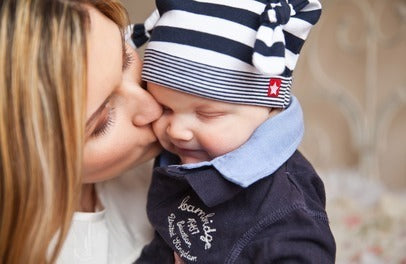 Photo of Mom kissing Baby