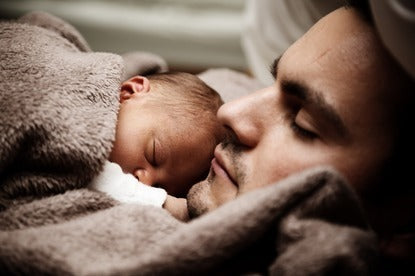 Photo of Baby napping with Dad